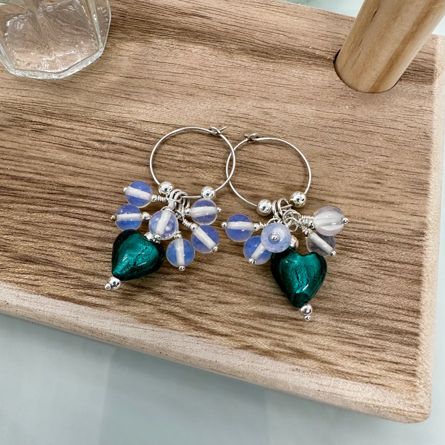 Sterling silver hoop earrings with opalite beads and teal artisan glass heart charm, handmade cluster style jewellery