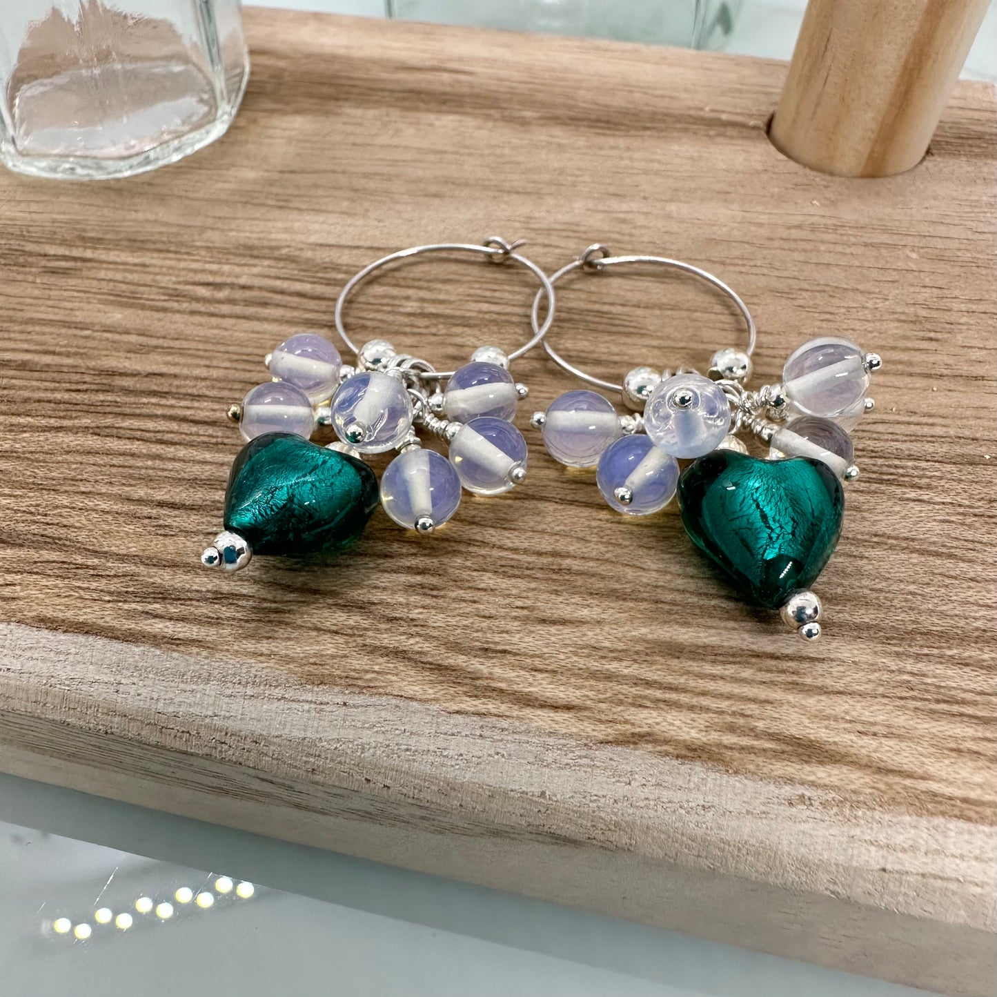 Sterling silver hoop earrings with opalite beads and teal artisan glass heart charm, handmade cluster style jewellery