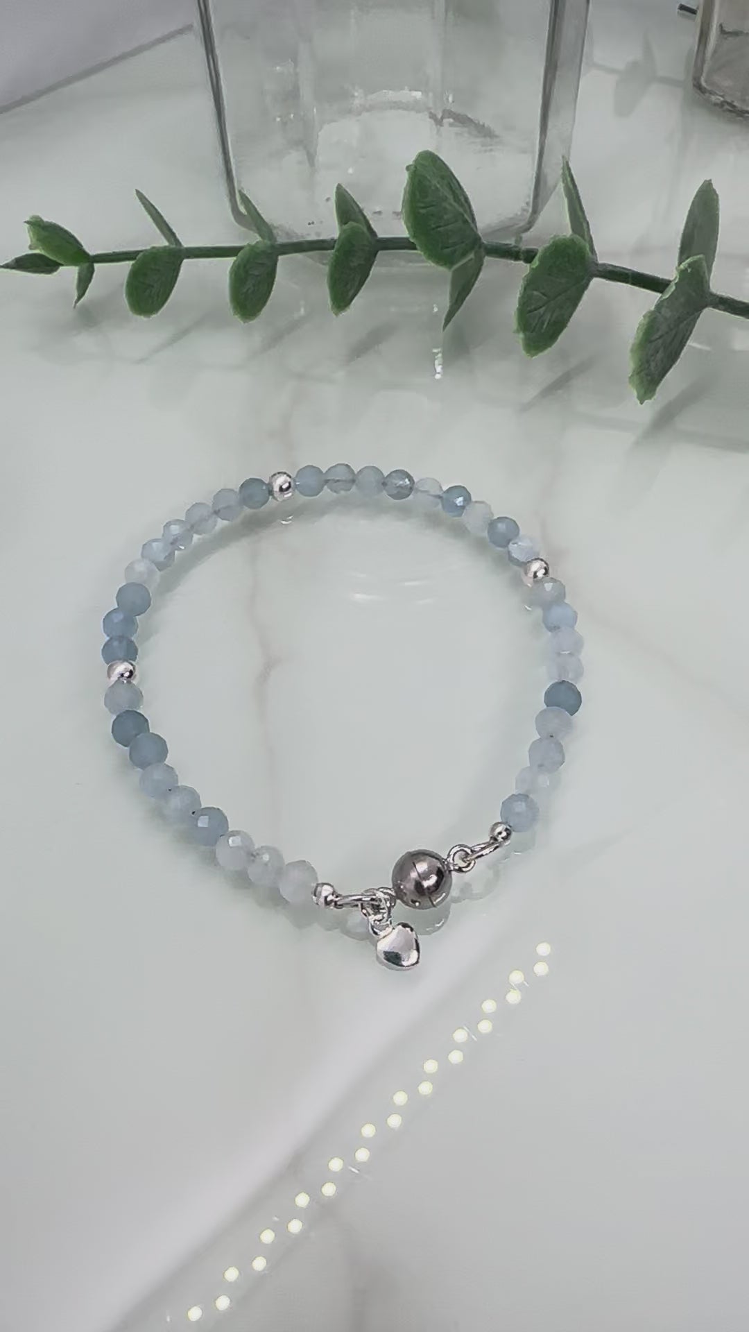 Dainty faceted aquamarine sterling silver bracelet with heart charm and magnetic clasp, March birthstone jewellery UK